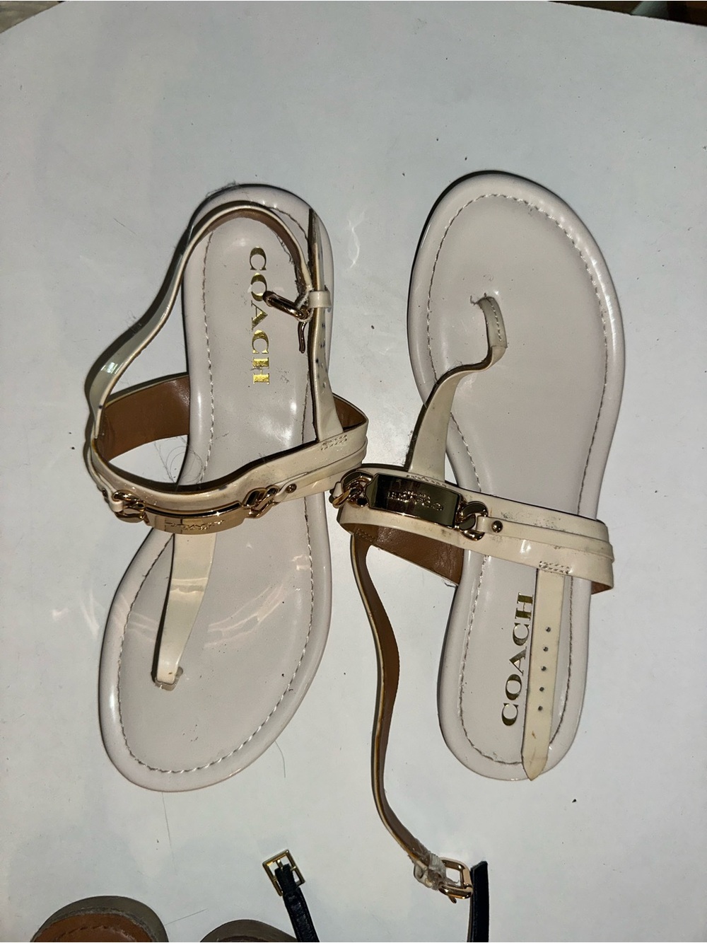 COACH Ivory Patent Leather T-Strap Sandals with Gold-Tone Hardware
